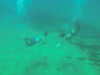 People swimming in sea