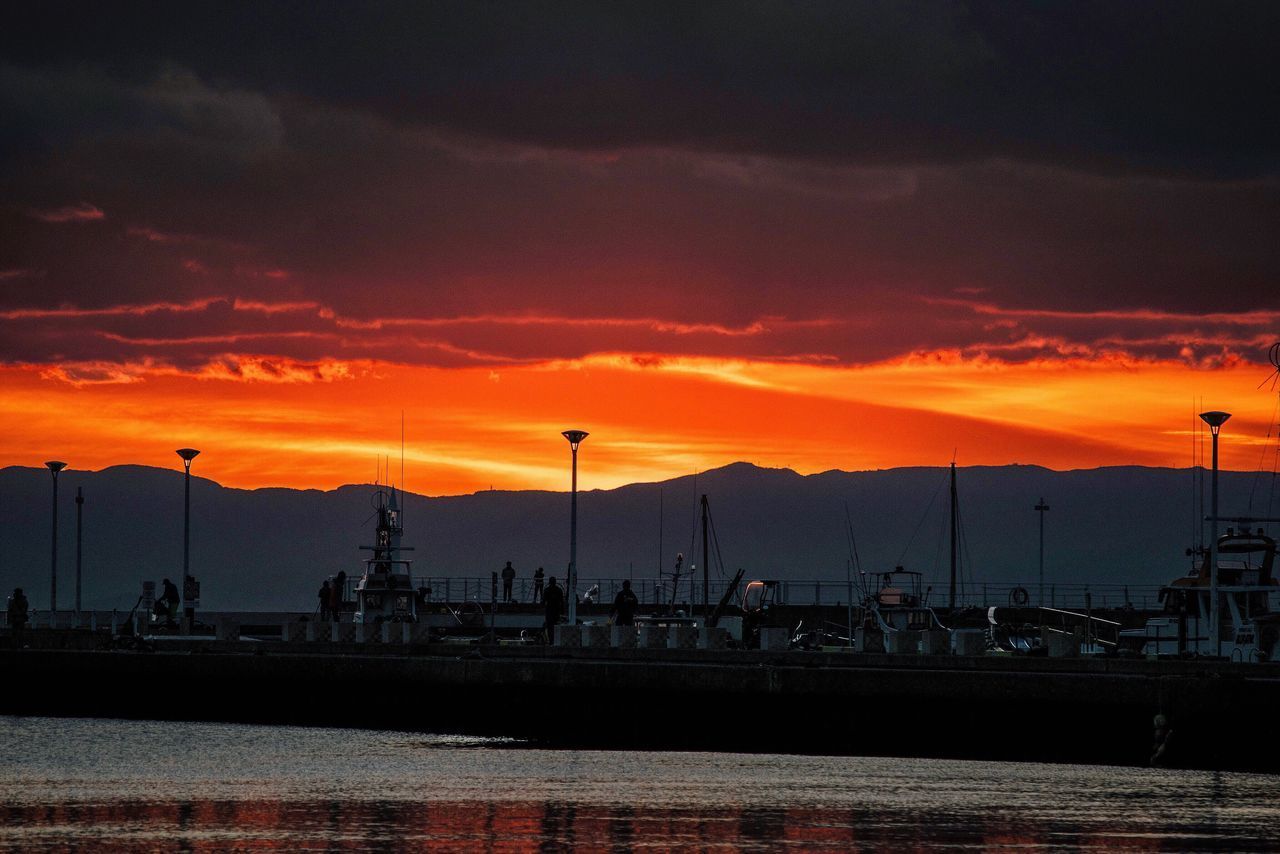 SILHOUETTE HARBOR AGAINST SKY DURING SUNSET