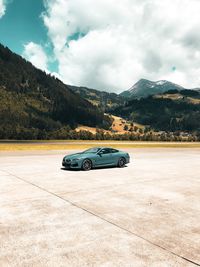 View of car on mountain against sky