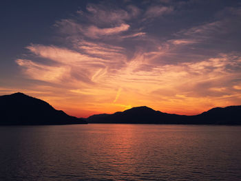 Scenic view of sea against romantic sky at sunset