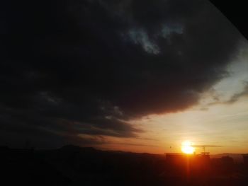 Silhouette landscape against scenic sky