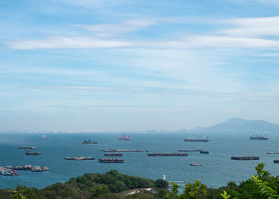 High angle view of sailboats in sea against sky