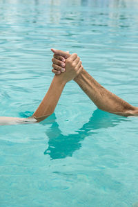 Man surfing in swimming pool