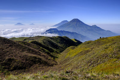 View of landscape with mountain range in the background