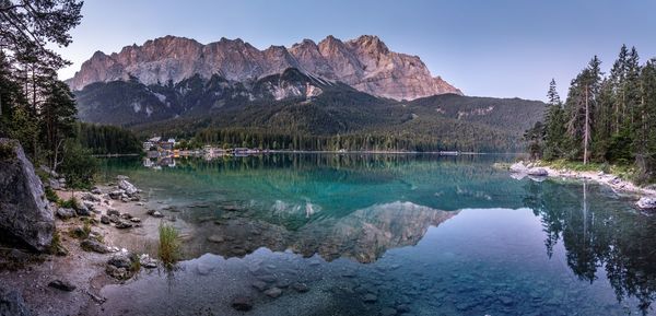 Scenic view of lake and mountains against sky