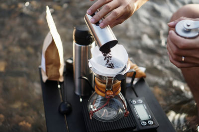 Close-up of hand holding drink