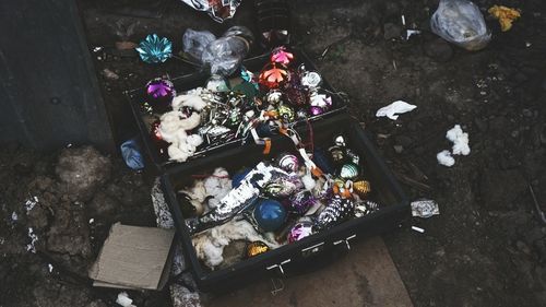 High angle view of abandoned decoration material in bag at junkyard
