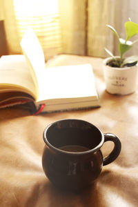 Close-up of coffee cup on table