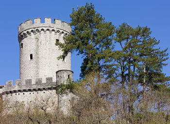 Low angle view of historic building against clear blue sky