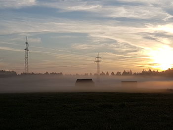 Scenic view of field against sky during sunset