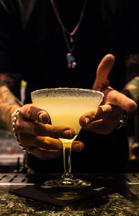 Midsection of man holding ice cream