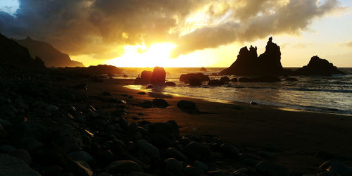 Scenic view of sea against sky at sunset