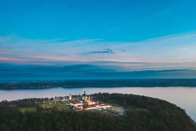 Aerial view of palace amidst forest