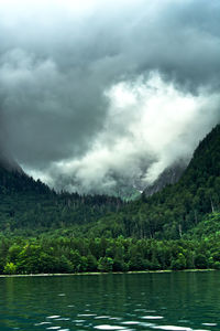 Scenic view of lake and mountains against sky
