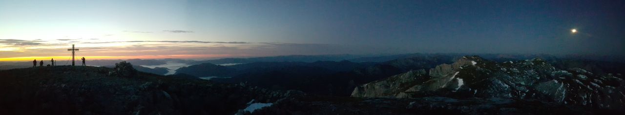 Panoramic view of mountains against sky at sunset