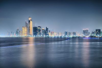 Illuminated buildings in city at night