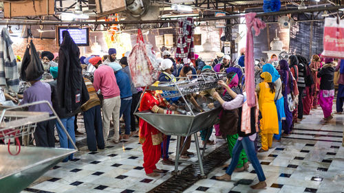 People at market stall in city