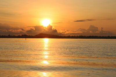 Scenic view of sea against sky at sunset