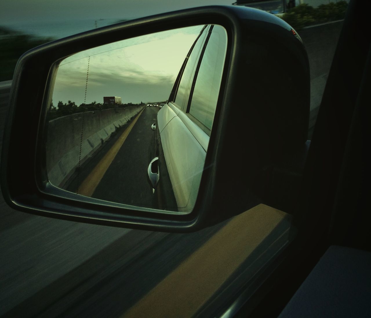 transportation, mode of transport, land vehicle, car, vehicle interior, car interior, side-view mirror, travel, glass - material, windshield, transparent, road, window, on the move, part of, reflection, journey, cropped, road trip, vehicle part