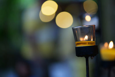 Close-up of lit tea light candles