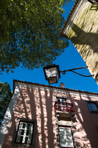 Low angle view of building against blue sky