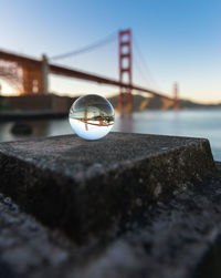 Close-up of crystal ball against clear sky