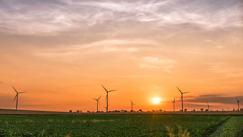 Scenic view of field against sky during sunset