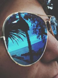 Close-up of hand with reflection in water