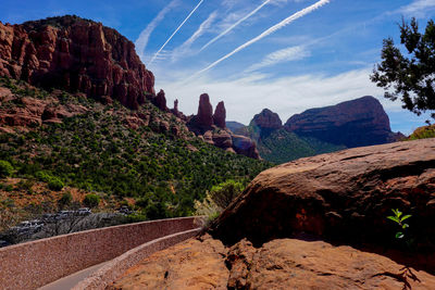 Rock formations on landscape against sky