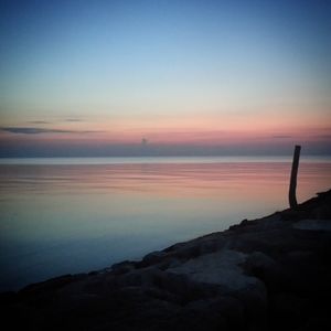 Scenic view of sea at sunset