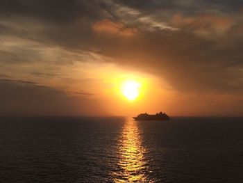 Scenic view of sea against sky during sunset