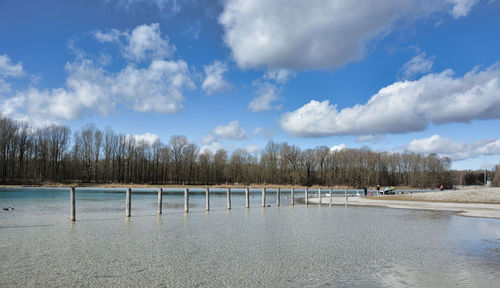 Scenic view of beach against sky during winter