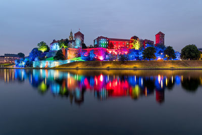Castel wawel in krakow, poland, colorfully illuminated by night