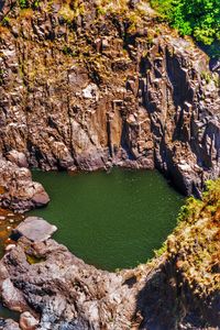 High angle view of lake amidst rock formation