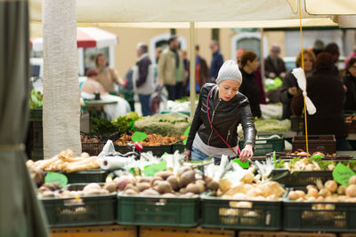 Group of people at market stall