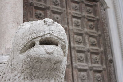 Low angle view of statue against building