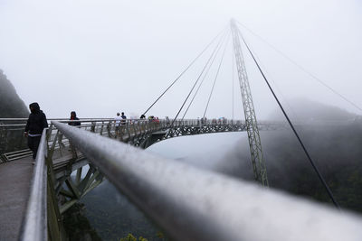 View of suspension bridge in foggy weather