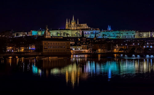 Illuminated buildings in city at night