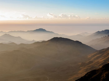 Scenic view of mountains against sky during sunset