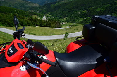 Man cycling on road amidst mountains