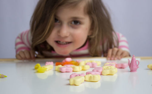 Portrait of a smiling girl with food