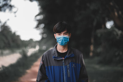 Portrait of mature man standing outdoors