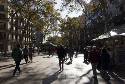 People walking on street in city