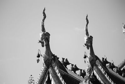 Low angle view of statue against sky