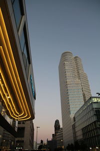 Low angle view of modern buildings against clear sky