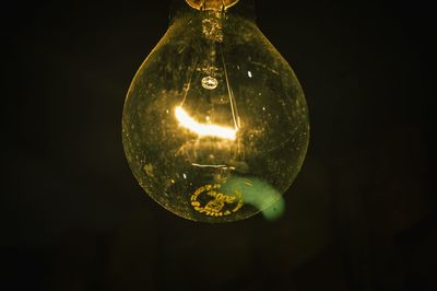 Low angle view of illuminated light bulb