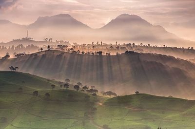 Panoramic view of landscape against cloudy sky