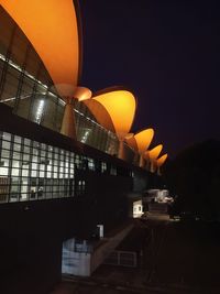 Illuminated modern building against sky at night