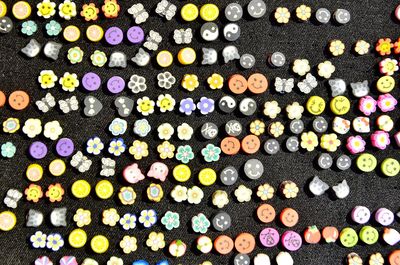 High angle view of colorful decorations on fabric