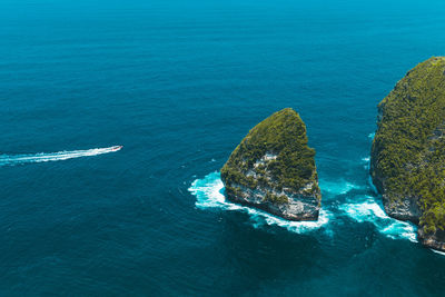 High angle view of rocks by sea